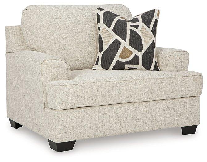 Ashley Furniture Heartcort living room set with a sofa and armchair featuring neutral upholstery and modern design.