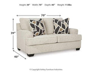 Ashley Furniture Heartcort Living Room Set with sofa and loveseat in a modern living space, showcasing plush upholstery and coordinated design.