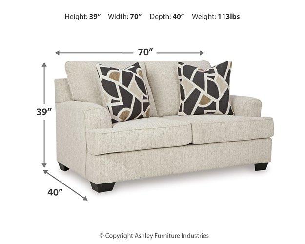 Ashley Furniture Heartcort Living Room Set with sofa and loveseat in a modern living space, showcasing plush upholstery and coordinated design.