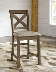 Ashley Moriville counter height dining set with four chairs and a rectangular table in a modern dining room.