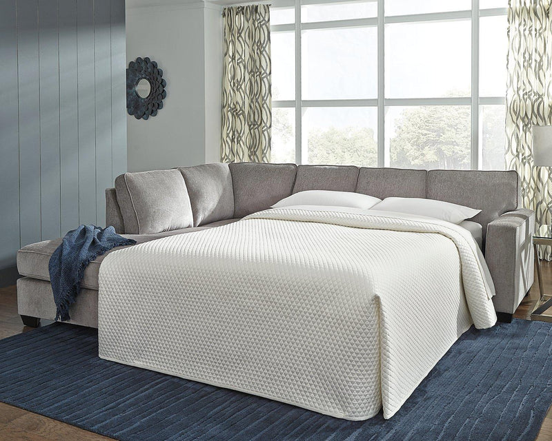 Ashley Furniture Altari living room set with sofa and armchair in a modern design, shown in a cozy, stylish living space.