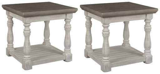 Ashley Furniture Havalance End Table Set featuring two modern wooden tables with sleek metal legs.
