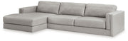 Ashley Furniture Amiata sectional with chaise, showcasing plush fabric and modern design in a spacious living room setting.