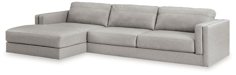 Ashley Furniture Amiata sectional with chaise, showcasing plush fabric and modern design in a spacious living room setting.