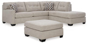 Ashley Furniture Mahoney living room set with a sofa and armchair, featuring neutral upholstery and modern design.
