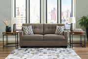 Ashley Mahoney living room set featuring a sofa and loveseat with plush cushions and neutral upholstery.