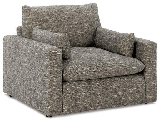 Oversized Ashley Furniture chair with plush upholstery and dramatic design, perfect for a stylish living room setting.