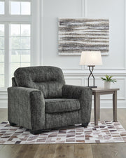 Ashley Furniture Lonoke living room set with sofa and loveseat featuring neutral upholstery and modern design.