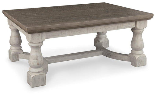 Ashley Furniture Havalance coffee table, modern cocktail table with a sleek wooden finish, suitable for living room décor.