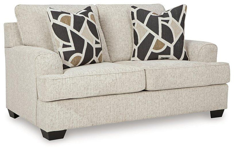 Ashley Furniture Heartcort living room set with a sofa and matching armchair, featuring plush cushions and contemporary design.