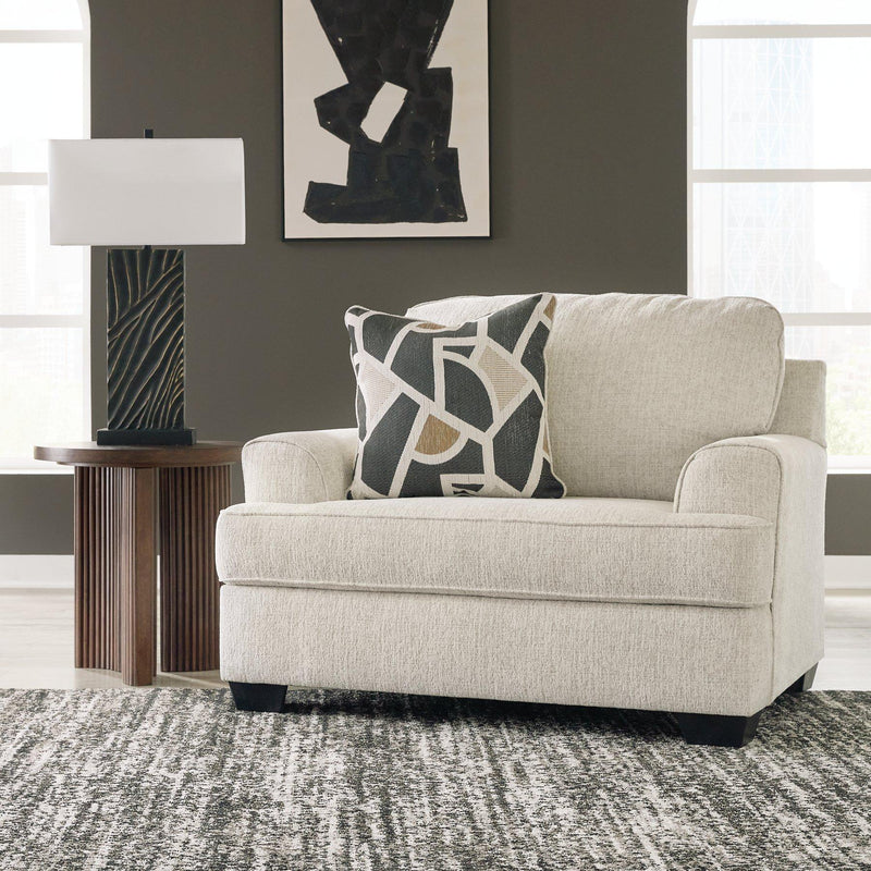 Ashley Furniture Heartcort living room set with sofa, loveseat, and armchair in a modern design, arranged in a cozy lounge setting.