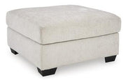 Oversized Ashley Furniture Aviemore accent ottoman with plush fabric and sturdy wooden legs, perfect for living room decor.
