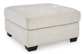 Oversized Ashley Furniture Aviemore accent ottoman with plush fabric and sturdy wooden legs, perfect for living room decor.