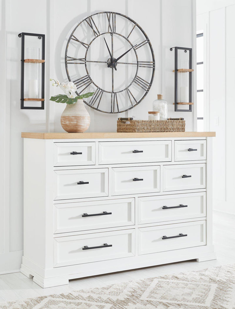 Ashbryn dresser by Ashley Furniture featuring a modern design with multiple drawers and a sleek wood finish.