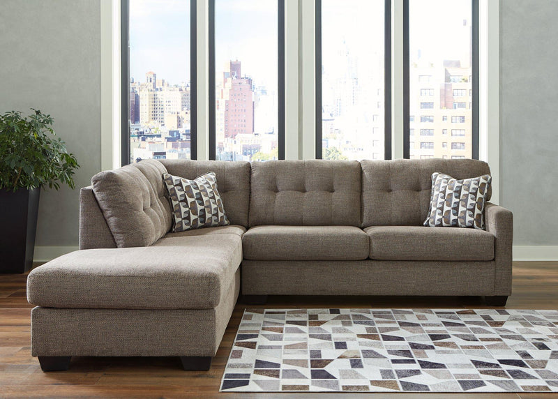 Ashley Furniture Mahoney living room set with sofa, loveseat, and coffee table in a modern, cozy living space.
