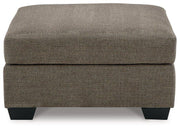 Ashley Furniture Mahoney living room set with sofa, loveseat, and coffee table arranged in a modern, comfortable living space.