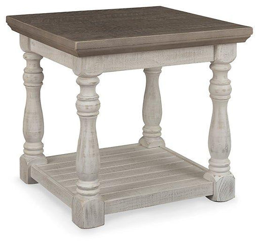 Ashley Furniture Havalance End Table with wood finish, featuring a sleek design and storage shelf in a modern living room setting