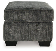 Ashley Furniture Lonoke living room set with sofa and chairs, featuring neutral upholstery and modern design.