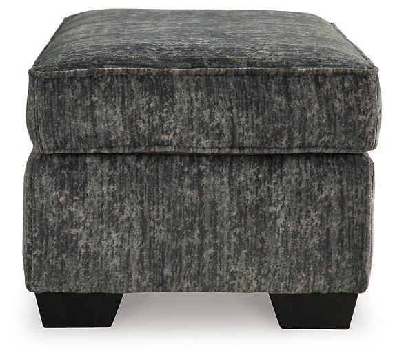 Ashley Furniture Lonoke living room set with sofa and chairs, featuring neutral upholstery and modern design.