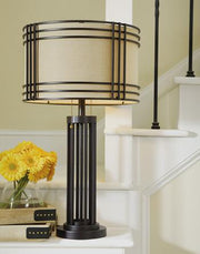 Ashley Furniture Hanswell table lamp set with two elegant lamps featuring neutral shades and classic design.