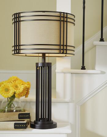 Ashley Furniture Hanswell table lamp set with two elegant lamps featuring neutral shades and classic design.