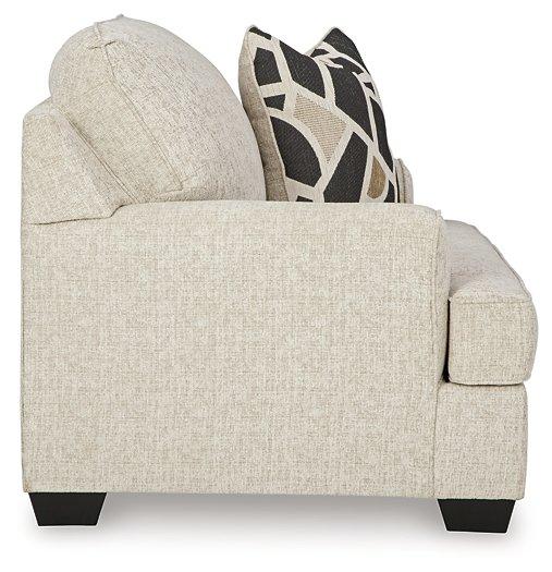 Ashley Furniture Heartcort living room set featuring a sofa, loveseat, and armchair in a modern design with neutral upholstery.