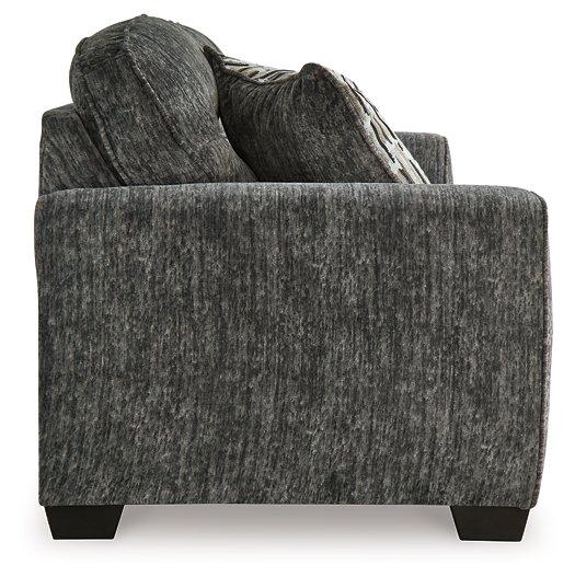 Ashley Furniture Lonoke living room set with sofa and armchairs in a modern design, showcasing plush upholstery and stylish accents.