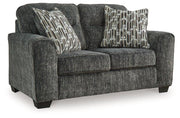 Ashley Furniture Lonoke living room set featuring a sofa and loveseat with neutral upholstery and modern design.