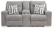 Ashley Furniture Biscoe living room set with a sofa and armchair, featuring plush cushions and neutral upholstery in a modern design.