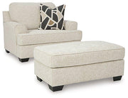Ashley Furniture Heartcort living room set with sofa and armchair, featuring plush cushions and modern design.