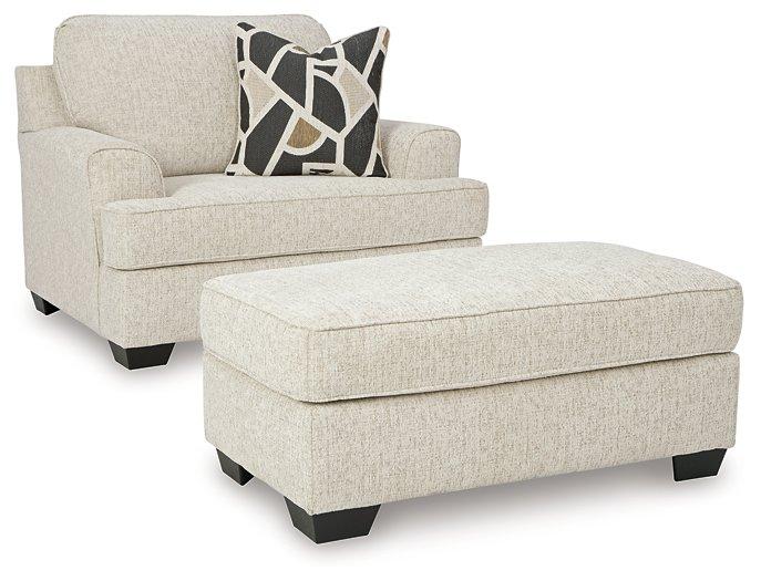 Ashley Furniture Heartcort living room set with sofa and armchair, featuring plush cushions and modern design.
