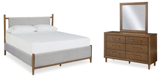 Ashley Furniture Lyncott bedroom set with a bed, nightstands, and matching dresser in a modern bedroom design.