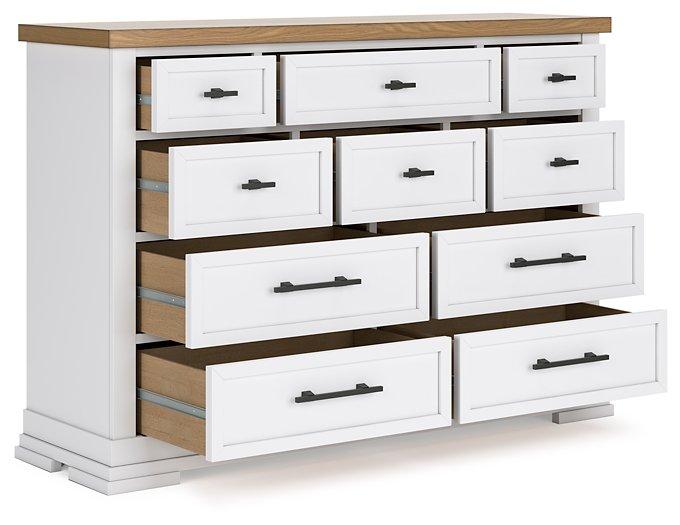 Ashbryn dresser by Ashley Furniture featuring a modern wooden design with multiple drawers and sleek hardware.