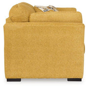 Ashley Furniture Keerwick living room set with sectional sofa and matching ottoman in a modern living space.