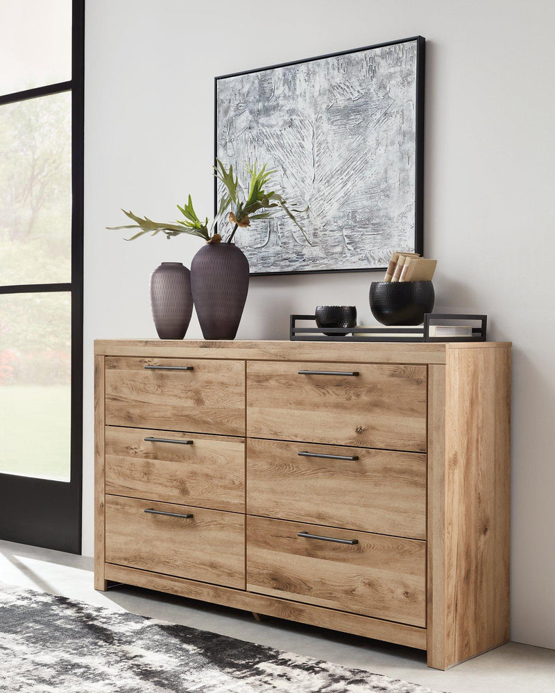 Modern Ashley Furniture Hyanna Dresser with sleek wood finish and six spacious drawers, ideal for bedroom storage.