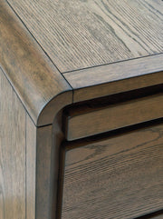 Ashley Furniture Jensworth accent table with a sleek wooden surface and modern design for stylish home decor.