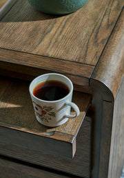 Ashley Furniture Jensworth accent table with a sleek wood finish and modern design, perfect for living room or bedroom décor.