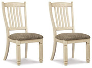 Ashley Furniture Bolanburg dining chair with upholstered seat and wooden legs, shown from a side view.