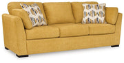 Ashley Furniture Keerwick living room set with sofa and armchair, featuring neutral upholstery and modern design.