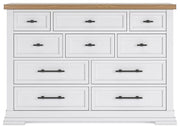Ashbryn dresser by Ashley Furniture shown in a modern bedroom setting with multiple drawers and a sleek wood finish.