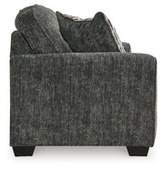 Ashley Furniture Lonoke living room set with sofa and loveseat in a modern design, shown in a cozy, stylish living space.