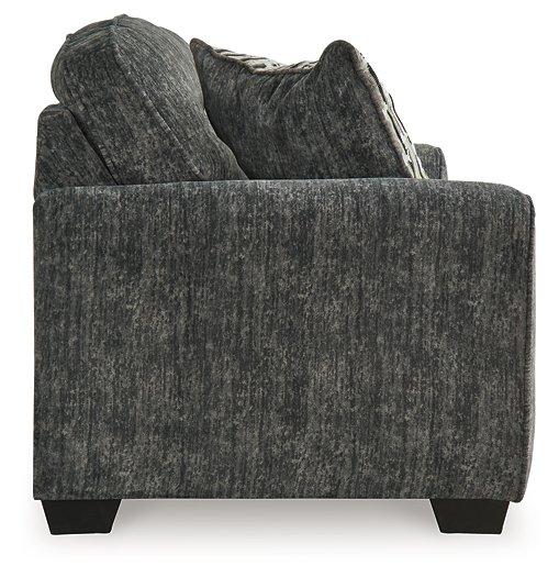 Ashley Furniture Lonoke living room set with sofa and loveseat in a modern design, shown in a cozy, stylish living space.