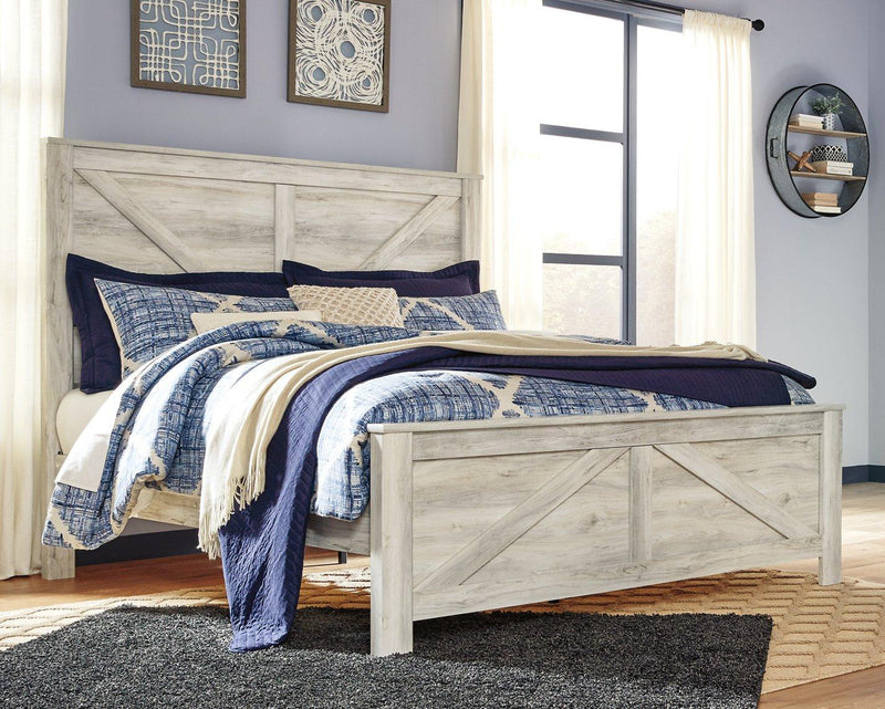 Ashley Furniture Bellaby Crossbuck Bed with a sturdy wooden frame and classic crossbuck headboard for a rustic bedroom look.