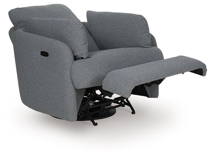 Ashley Furniture Alainmont Next-Gen Nuvella swivel power recliner accent chair with plush upholstery and modern design.