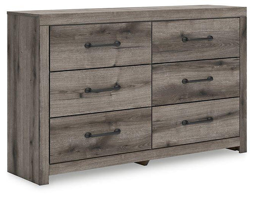 Graystorm dresser by Ashley Furniture showing a modern gray wooden dresser with multiple drawers and sleek hardware.