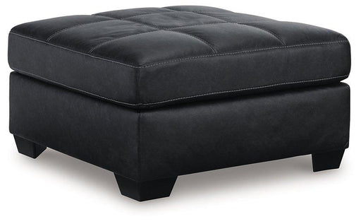 Ashley Furniture Barlin Mills oversized accent ottoman with plush fabric and sturdy wooden legs, designed for stylish living room seating.