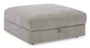 Ashley Furniture Aslan Court Ottoman with storage, beige fabric, wooden legs, and a plush cushioned top for seating and organization.