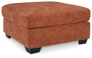 Ashley Furniture Aviemore oversized accent ottoman with plush fabric and sturdy wooden legs, perfect for living room decor.