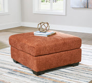Ashley Furniture Aviemore oversized accent ottoman with plush fabric and tufted top, perfect for living room decor.