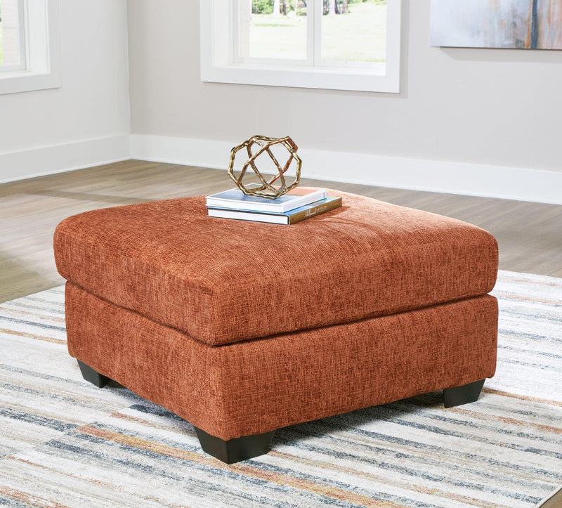 Ashley Furniture Aviemore oversized accent ottoman with plush fabric and tufted top, perfect for living room decor.